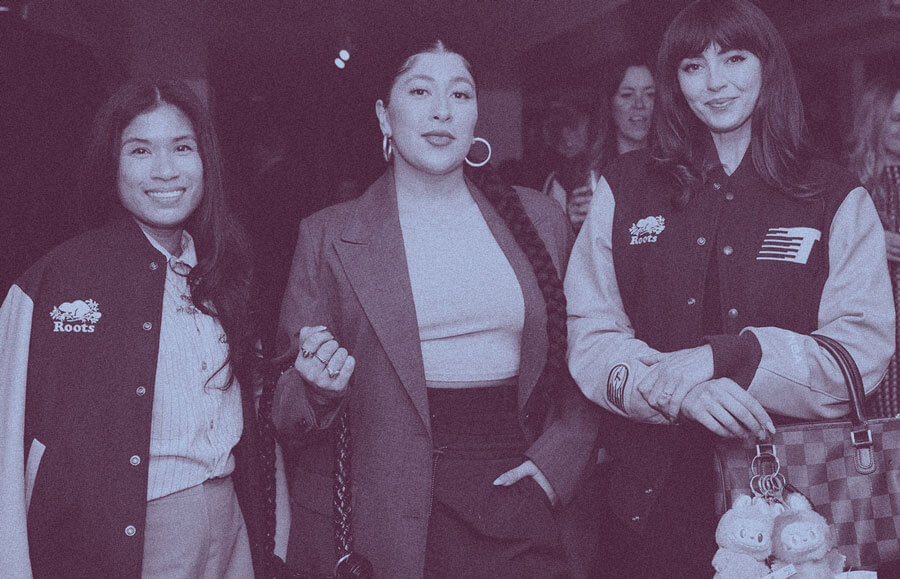 Three women wearing tempo team jackets