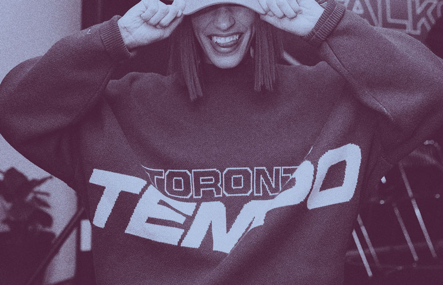 Woman wearing Tempo knit sweater